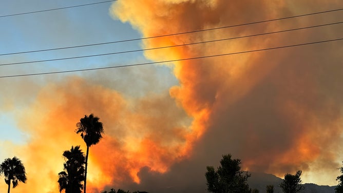 Wildfire burns in Riverside County, CA.