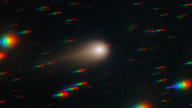 Comet 3I/ATLAS streaks across a dense star field in this image captured by the Gemini Multi-Object Spectrograph (GMOS) on Gemini South at Cerro Pachón in Chile, one half of the International Gemini Observatory, partly funded by the U.S. National Science Foundation (NSF) and operated by NSF NOIRLab. This image is composed of exposures taken through four filters — red, green, blue and ultraviolet. As exposures are taken, the comet remains fixed in the center of the telescope’s field of view. However, the positions of the background stars change relative to the comet, causing them to appear as colorful streaks in the final image.