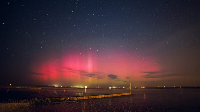 dpatop - 02 September 2025, Lower Saxony, Wangerland: Northern lights can be seen from the beach in Hooksiel in the district of Friesland. With the start of the aurora borealis season and the current solar cycle, there is a good chance of seeing aurora borealis, also known as the Northern Lights, in the night sky over the next few months. Photo: Markus Hibbeler/dpa (Photo by Markus Hibbeler/picture alliance via Getty Images)