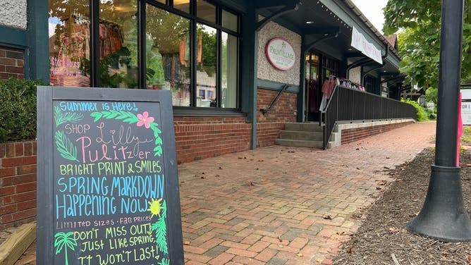 A sign reminds shoppers of sales at a Lilly Pulitzer store in Biltmore Village.