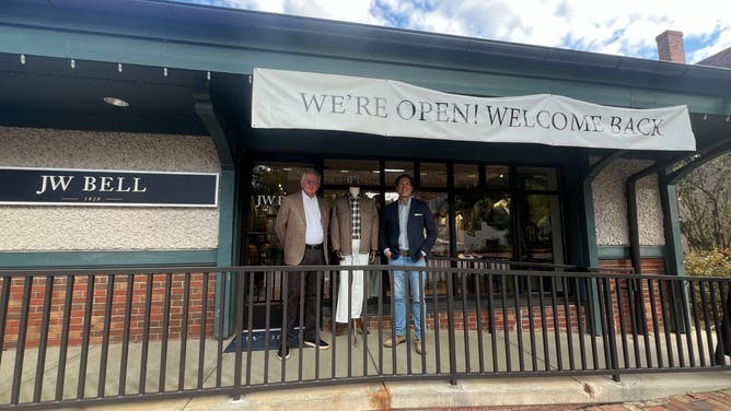 Employees of JW Bell showcase some of their wares outside their store in Biltmore Village.