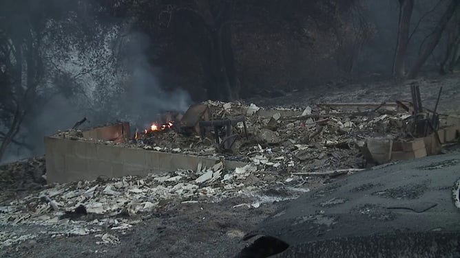 This image shows a structure that was destroyed by flames from the 2-7 Wildfire burning in Calaveras County, California, on Sept. 2, 2025.