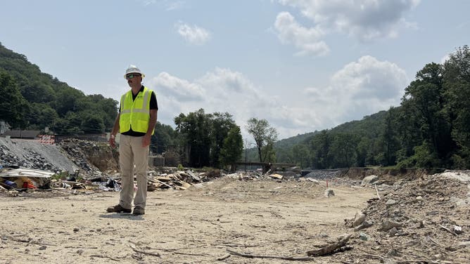 Miles Bell, with Duke Energy, in Chimney Rock, North Carolina after Hurricane Helene's floods in 2024.
