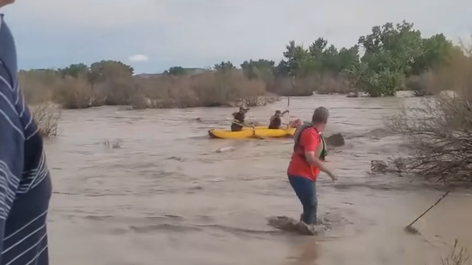 First responders and civilians enactment    to rescue a antheral   stranded successful  rushing h2o  successful  Green River, Utah connected  Saturday, Sept. 13, 2025. 