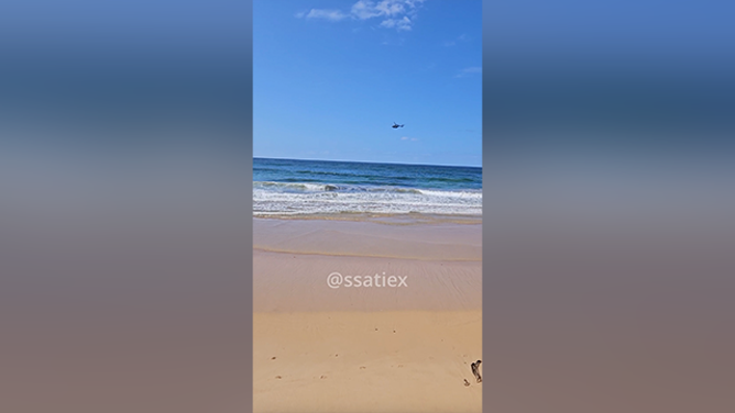 This image shows the emergency response after a fatal shark attack at a beach in Sydney, Australia, on Saturday, Sept. 6, 2025.