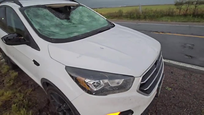 See it: Monster hail blasted by 70 mph wind leaves car in ruins alongside Nebraska highway