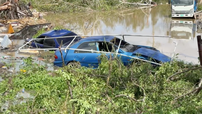 Car in floodwater.