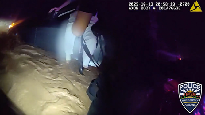 This image shows Apache Junction police helping to save a man trapped in floodwaters on Oct. 13, 2025.