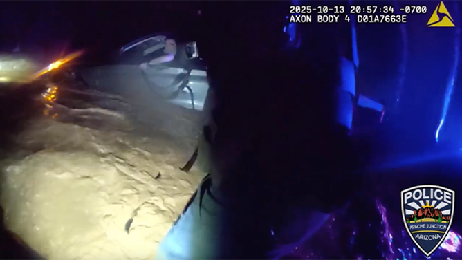 This image shows Apache Junction police helping to save a man trapped in floodwaters on Oct. 13, 2025.