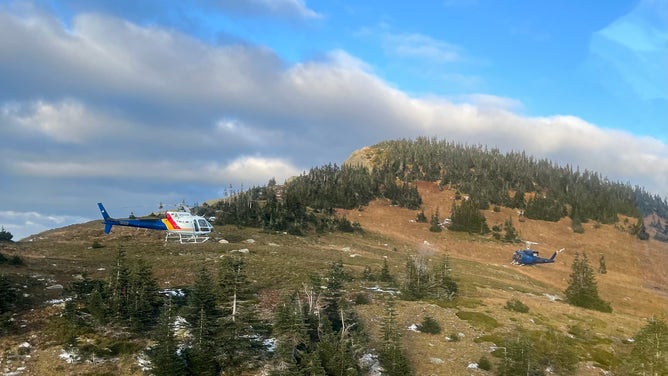 Helicopters fly around the Pass Lake area in British Columbia.