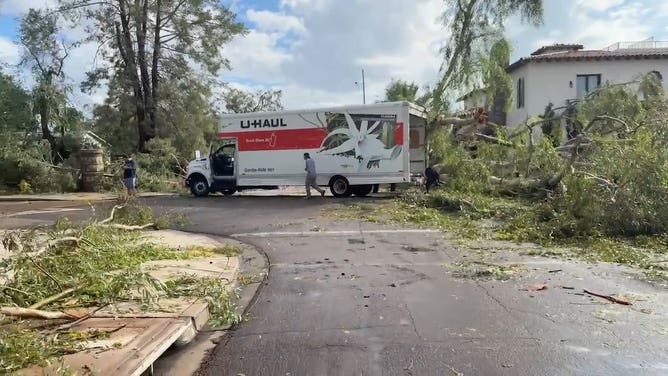 Significant damage reported after a microburst wreaked havoc in Tempe, Arizona.