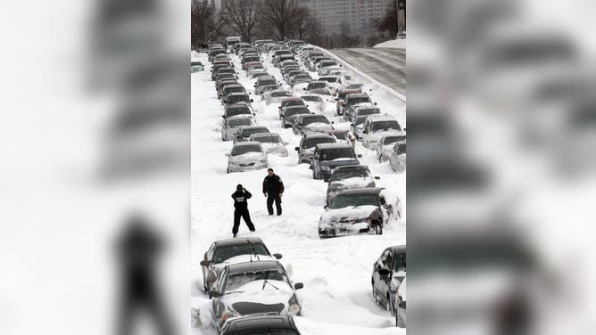 Cars sit in the northbound lanes of Lake Shore Drive after accidents and drifting snow stranded the drivers during last night's blizzard February 2, 2011 in Chicago, Illinois