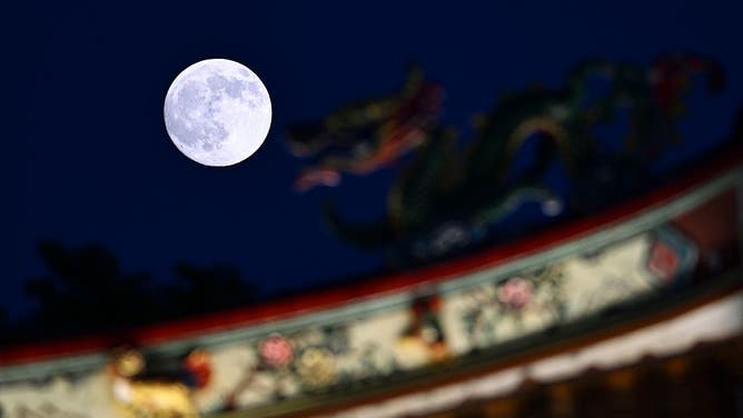 A supermoon lights up the night sky during the Mid-Autumn Festival on October 6, 2025 in Suzhou, Jiangsu Province of China.