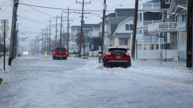 AVALON, NEW JERSEY - OCTOBER 12: A powerful nor'easter brings coastal flooding to the Jersey Shore on Sunday afternoon, with high tide sending water over docks and into streets in Avalon, New Jersey, United States on October 12, 2025. Strong winds and heavy surf caused dangerous conditions along the coast as officials urged residents to avoid flooded areas. (Photo by Lokman Vural Elibol/Anadolu via Getty Images)