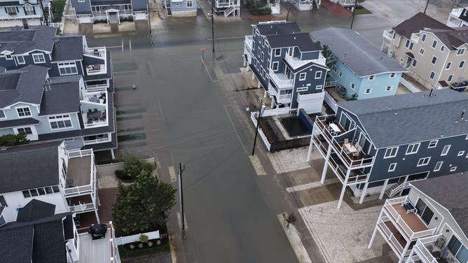 AVALON, NEW JERSEY - OCTOBER 12: A powerful nor'easter brings coastal flooding to the Jersey Shore on Sunday afternoon, with high tide sending water over docks and into streets in Avalon, New Jersey, United States on October 12, 2025. Strong winds and heavy surf caused dangerous conditions along the coast as officials urged residents to avoid flooded areas. (Photo by Lokman Vural Elibol/Anadolu via Getty Images)