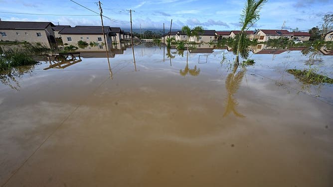 Flooded homes are seen after the passage of Hurricane Melissa in Howard Acres neighbourhood in St. Elizabeth, Jamaica on October 29, 2025. Hurricane Melissa ripped up trees and knocked out power after making landfall in Jamaica on October 28, 2025 as one of the most powerful hurricanes on record, inundating the island nation with rains that threaten flash floods and landslides.