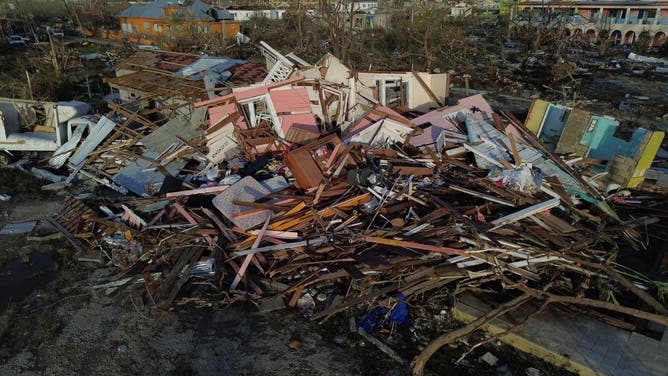 An aerial view of destroyed buildings following the passage of Hurricane Melissa, in Black River, St. Elizabeth, Jamaica on October 29, 2025. Hurricane Melissa bore down on the Bahamas October 29 after cutting a path of destruction through the Caribbean, leaving 30 people dead or missing in Haiti and parts of Jamaica and Cuba in ruins.
