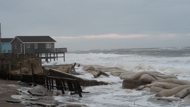 Debris from homes washed away by rough surf in Buxton, North Carolina after Hurricane Imelda passed off shore in October 2025.