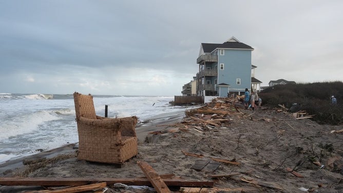Debris from homes washed away by rough surf in Buxton, North Carolina after Hurricane Imelda passed off shore in October 2025.