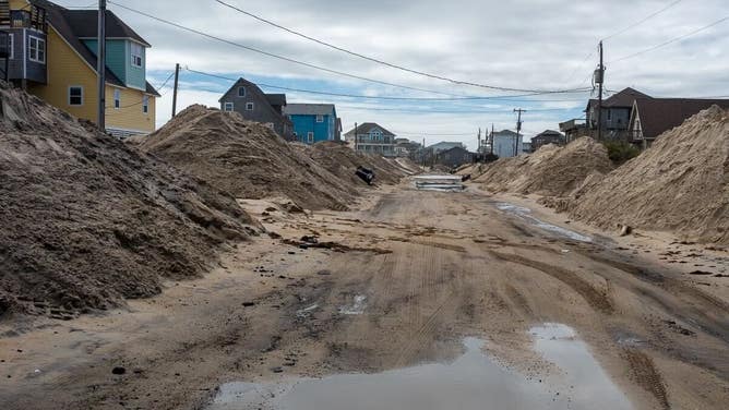 Debris from homes washed away by rough surf in Buxton, North Carolina after Hurricane Imelda passed off shore in October 2025.