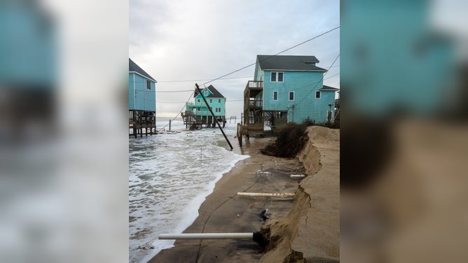 Debris from homes washed away by rough surf in Buxton, North Carolina after Hurricane Imelda passed off shore in October 2025.