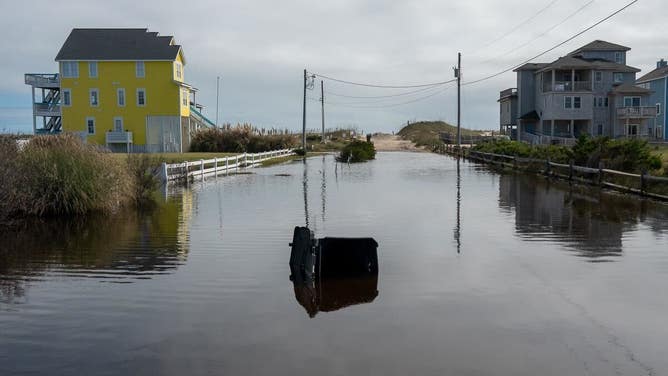 Debris from homes washed away by rough surf in Buxton, North Carolina after Hurricane Imelda passed off shore in October 2025.