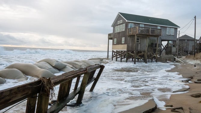 Debris from homes washed away by rough surf in Buxton, North Carolina after Hurricane Imelda passed off shore in October 2025.