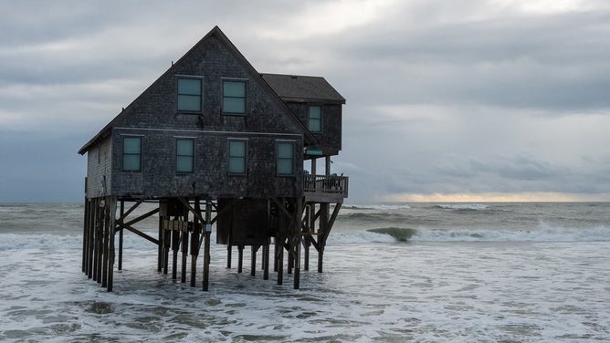 Debris from homes washed away by rough surf in Buxton, North Carolina after Hurricane Imelda passed off shore in October 2025.