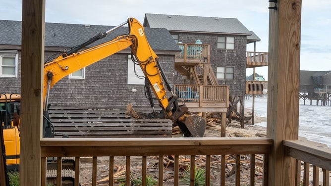 Debris from homes washed away by rough surf in Buxton, North Carolina after Hurricane Imelda passed off shore in October 2025.