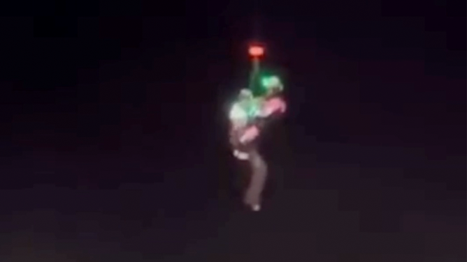A person is lifted out of floodwaters during dangerous flooding in Maricopa County, Arizona.