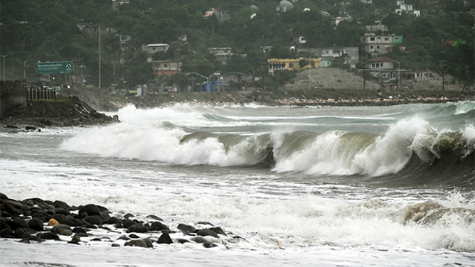 Storm surge is pictured before the arrival of Hurricane Melissa in the Caribbean Terrace area of Kingston, Jamaica, on October 25, 2025. Deadly storm Melissa strengthened Saturday afternoon into a Category 1 hurricane, with rapid intensification expected over the weekend as it cut a worryingly slow course toward the Caribbean island of Jamaica, forecasters said. (Photo by Ricardo Makyn / AFP) (Photo by RICARDO MAKYN/AFP via Getty Images)
