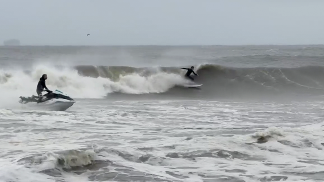 Surfers on Long Beach, New York on Monday, Oct. 13, 2025.