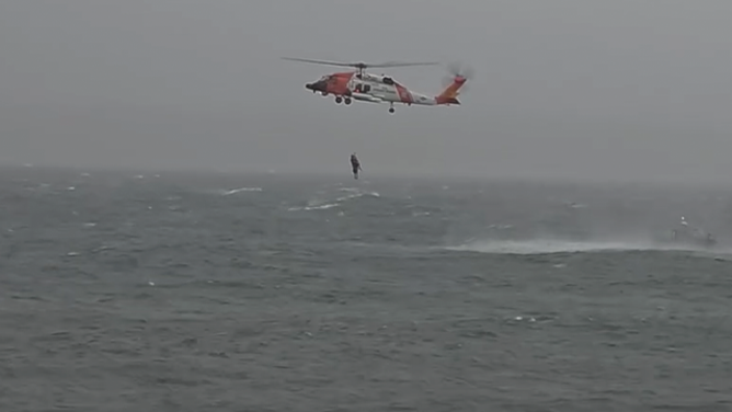 This image shows the U.S. Coast Guard rescuing someone from the Atlantic off the Massachusetts coast as a deadly nor'easter raged on Oct. 13, 2025.
