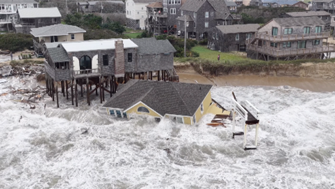 This image shows homes along North Carolina's Outer Banks collapsing into the Atlantic due to the impacts of Hurricane Imelda.