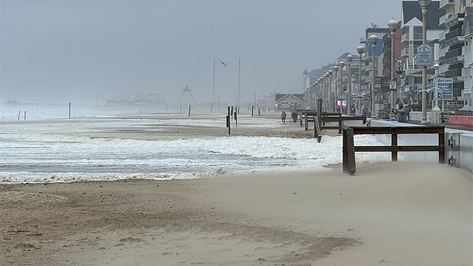 Water is seen rushing onto the beach in Ocean City, Maryland, during a nor'easter on Oct. 12, 2025.