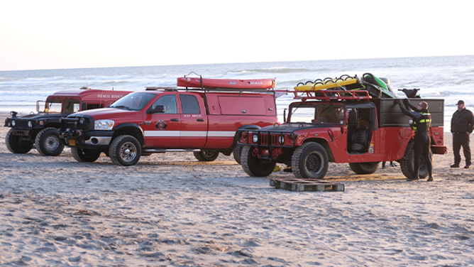 This image shows first responders on the shore as they searched for someone who became caught in a strong current and was pulled out to sea in Oregon on Sunday, Oct. 19, 2025.