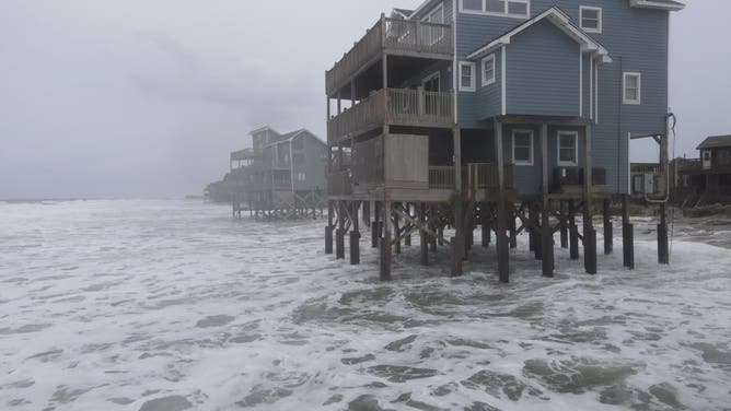 Extra supports and board help keep beach houses on Buxton's beaches standing.