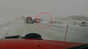 Dashcam: First responders leap out of reckless driver's way during North Dakota blizzard