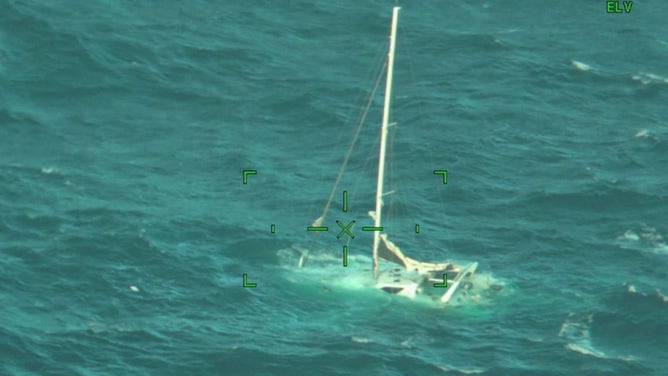 The sinking sailboat that five people had to abandon after it began taking on water.