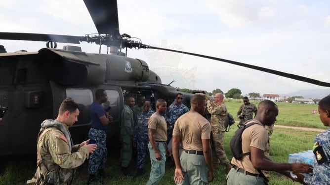 Jamaica Defence Force agents working with the United States Army on the ground in Jamaica to provide supplies two weeks after Hurricane Melissa.