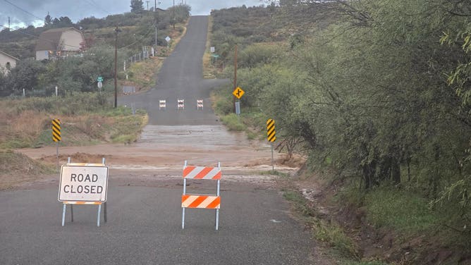A closed section of road in Cordes Lakes, Arizona, during flash flooding.