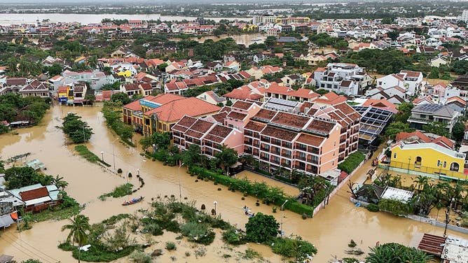 This aerial picture shows floodwaters inundating streets and buildings following heavy rains in Hoi An on October 30, 2025. Vietnam's coastal provinces have been lashed by heavy rains since October 26, with a record of up to 1.7 metres (five feet seven inches) falling over 24 hours.