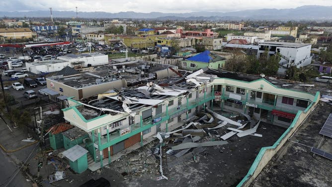 An aerial view shows damaged buildings in the aftermath of Hurricane Melissa in Savanna-la-Mar, Westmoreland, Jamaica, on October 31, 2025. At least 19 people in Jamaica have died as a result of Hurricane Melissa which devastated the island nation when it roared ashore this week, a government minister told news outlets late October 31. (Photo by Ricardo Makyn / AFP) (Photo by RICARDO MAKYN/AFP via Getty Images)
