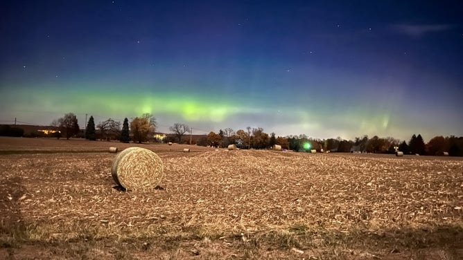 Northern lights dazzle over Lake Geneva, Wisconsin just after midnight on Nov. 6, 2025.