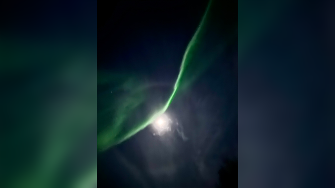 The northern lights dazzled in front of the Supermoon in Anchorage, Alaska on Thursday, Nov. 6, 2025.