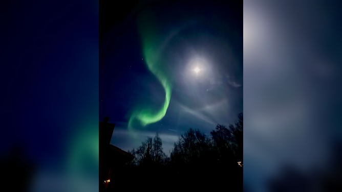 The northern lights dazzled in front of the Supermoon in Anchorage, Alaska on Thursday, Nov. 6, 2025.