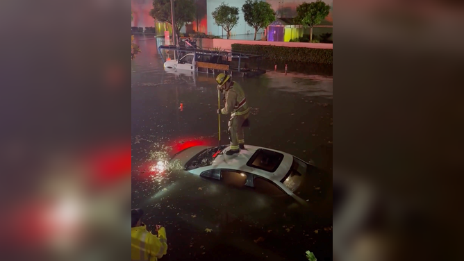 Fire crews on scene in Costa Mesa, California to asses anyone in danger from the floodwaters