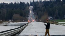 Entire city evacuated as Washington grapples with historic flooding, with more rain looming ahead