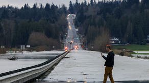 Entire city evacuated as Washington grapples with historic flooding, with more rain looming ahead