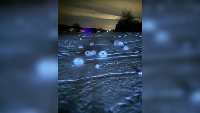 Snow rollers formed in a yard in Suttons Bay, Michigan, on Dec. 16, 2025.
